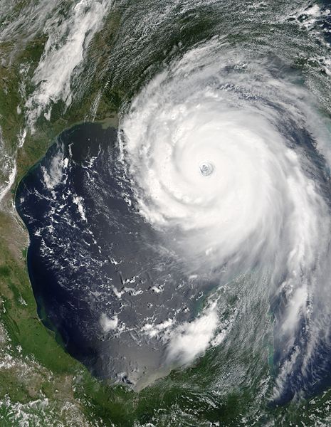 This photo shows a satellite image of the destructive Hurricane Katrina as it makes its way over both the ocean and the coast of the USA.