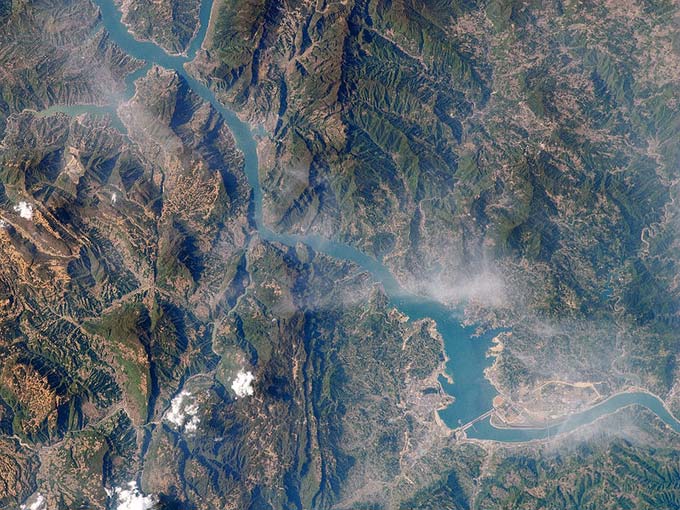 Located in China, the Yangtze River is one of the longest rivers in the world, reaching a length of around 6300 kilometres (3917 miles). This high altitude photo of the Yangtze River shows where the Three Gorges Dam is located.
