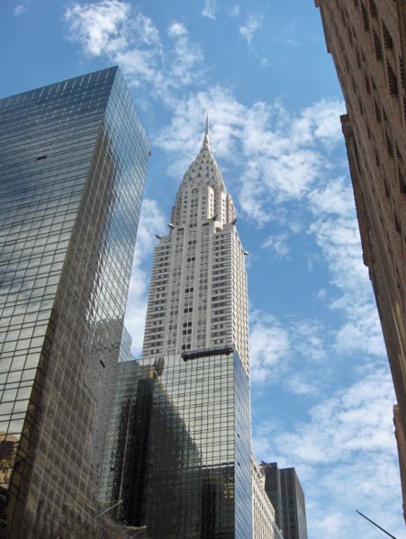 This photo looks up at the famous Chrysler Building in New York. Standing at an impressive 319 metres (1,047 ft) in height, the Chrysler Building was completed in May 1930. It features an Art Deco style of architecture and is widely thought of as being one of New York's most recognizable buildings.