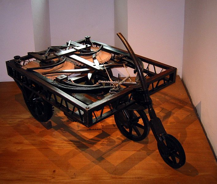 This photo shows a reconstruction of an early automobile invented by Leonardo da Vinci.