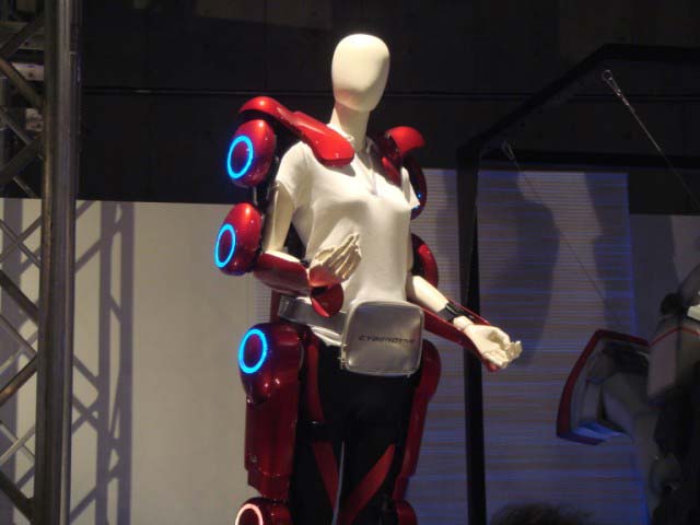 This strength suit is designed to increase the strength of whoever wears it, allowing people who might otherwise be capable to perform difficult strength related tasks such as lifting heavy boxes or moving heavy hospital patients. The strength suit is modeled by a dummy wearing a white shirt.