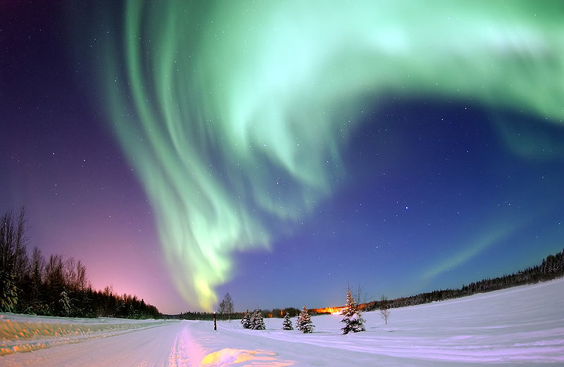 The aurora borealis (also known as the northern lights) is a spectacular light display that can be seen at night in regions near the North Pole (auroras can also be seen near the South Pole). Auroras occur because of charged particles that come from the Sun, these particles sometimes hit the Earth but we are protected by the Earth’s magnetic field. However, there are weak spots in the Earth’s magnetic field near the polar regions, this is where the charged particles react with particles in the air and create the aurora borealis, an amazing natural phenomenon. This incredible photo of the northern lights was taken near Bear Lake, Alaska.