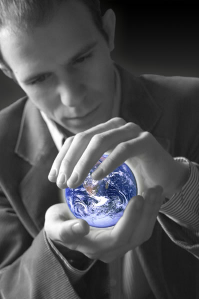 Symbolizing the importance of conservation, environmentalism and the planet in general this image shows a man in black and white gently cradling a small version of a beautifully colored earth in his hands. This photos meaning is even further accentuated by the current awareness of topics such as global warming in the news and media.