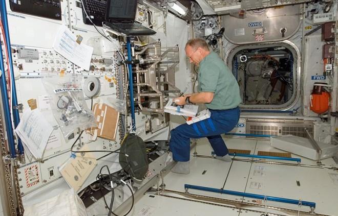 This photo shows an astronaut researching in the zero gravity environment of space.