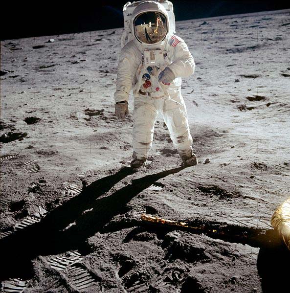 A NASA photo of American astronaut Buzz Aldrin as he walks on the moon in his spacesuit. 