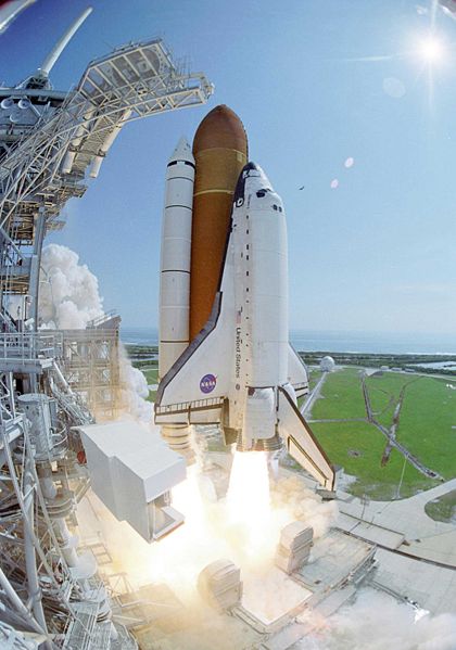 A NASA photo of the Space Shuttle Discovery as it launches into space on another important mission.