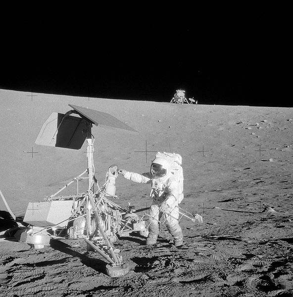 An iconic photo of an astronaut as he does field work on the moon.